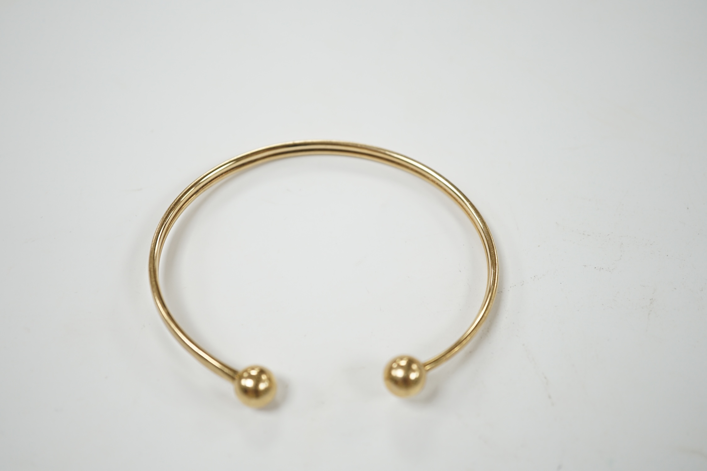 A 9ct gold torque bangle, 4.7 grams. Condition - fair to poor